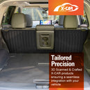 X-CAR back seat protectors installed in the rear of a Nissan X-Trail T33 SUV, shown with the back seats folded down to demonstrate fit and use. 