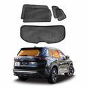 Set of X-CAR car window sunshades displayed in front of a black Nissan X-Trail T33 SUV on a white background.